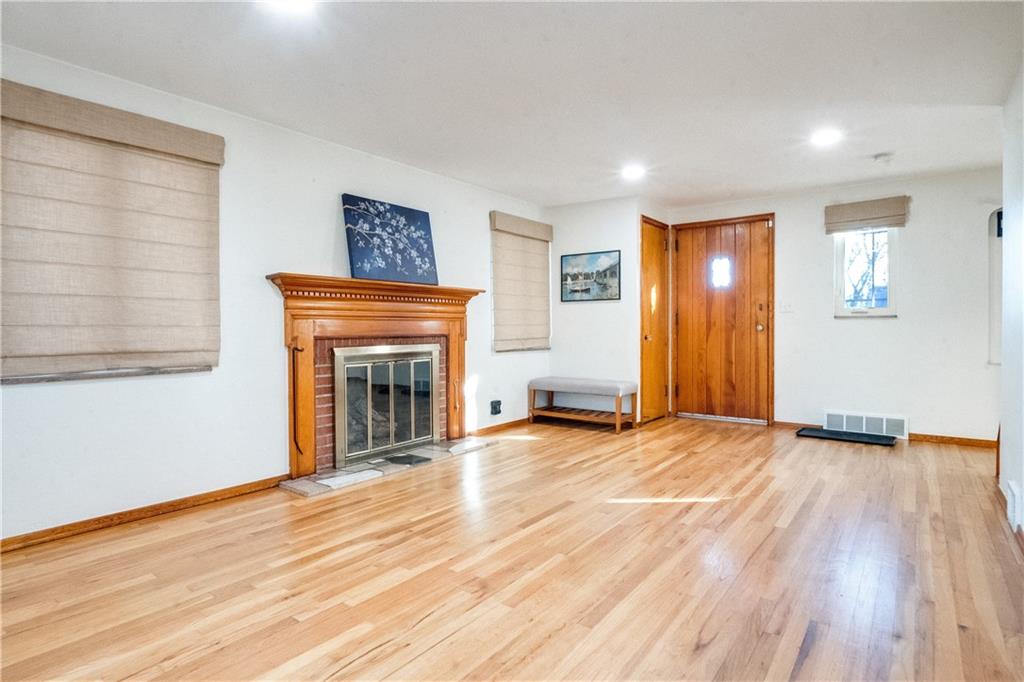 406 Bower Hill Road Pittsburgh, PA 15228 - Photo 5 of 26 a view of an empty room with glass door and wooden floor