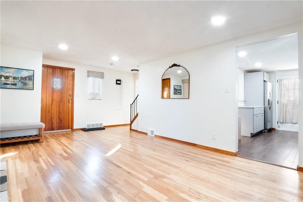 406 Bower Hill Road Pittsburgh, PA 15228 - Photo 7 of 26 a view of an empty room with wooden floor