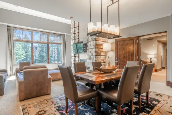 a view of a dining room with furniture window and outside view