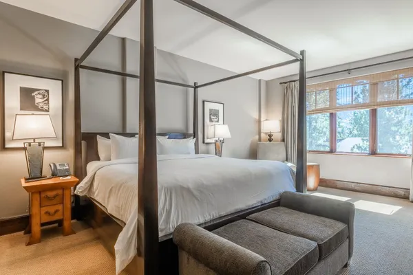 a bedroom with a bed and window