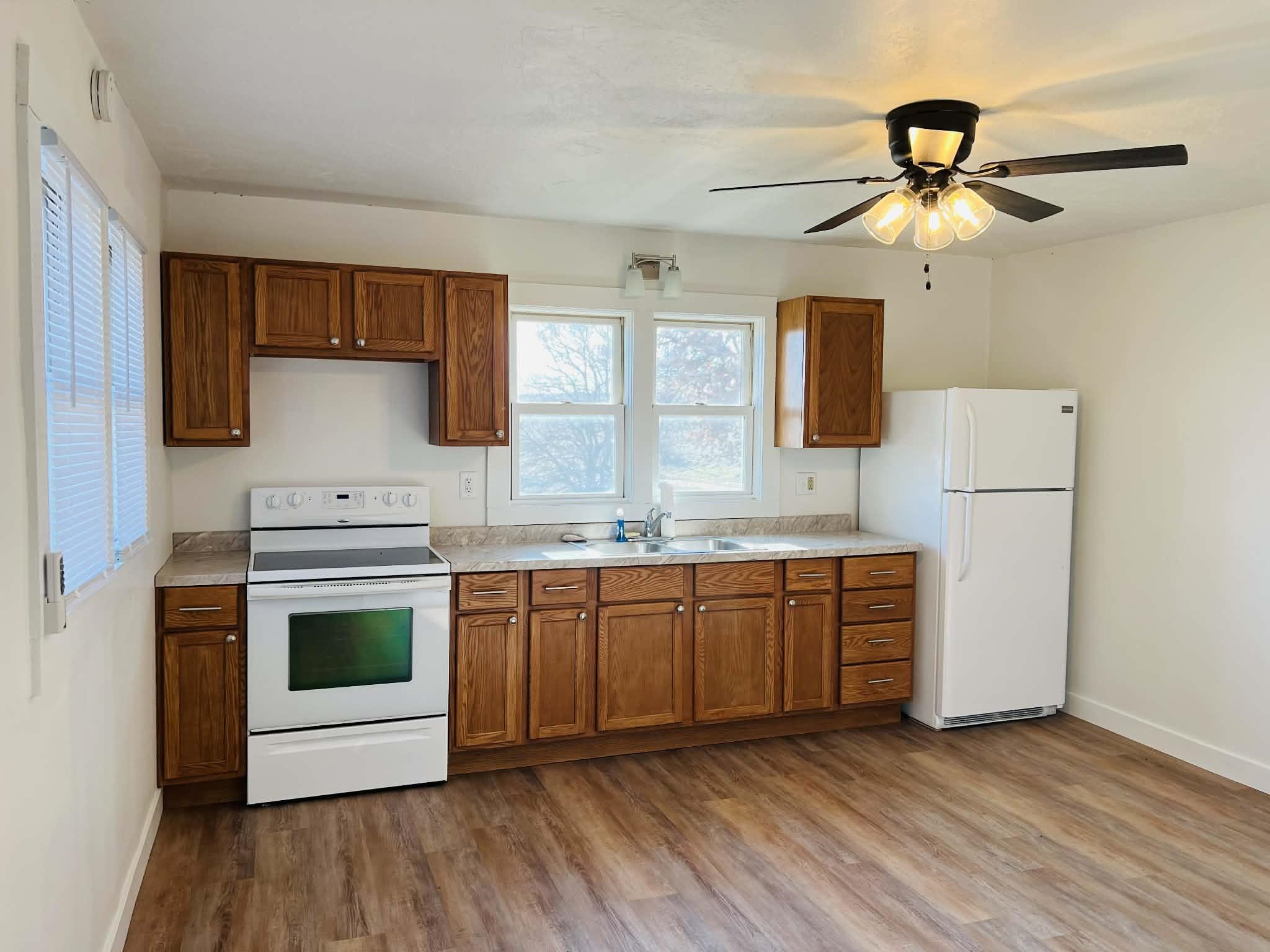 1625 South County Divide Road Pearl City, IL 61062 - Photo 11 of 30 a kitchen with stainless steel appliances granite countertop a stove a sink and a refrigerator