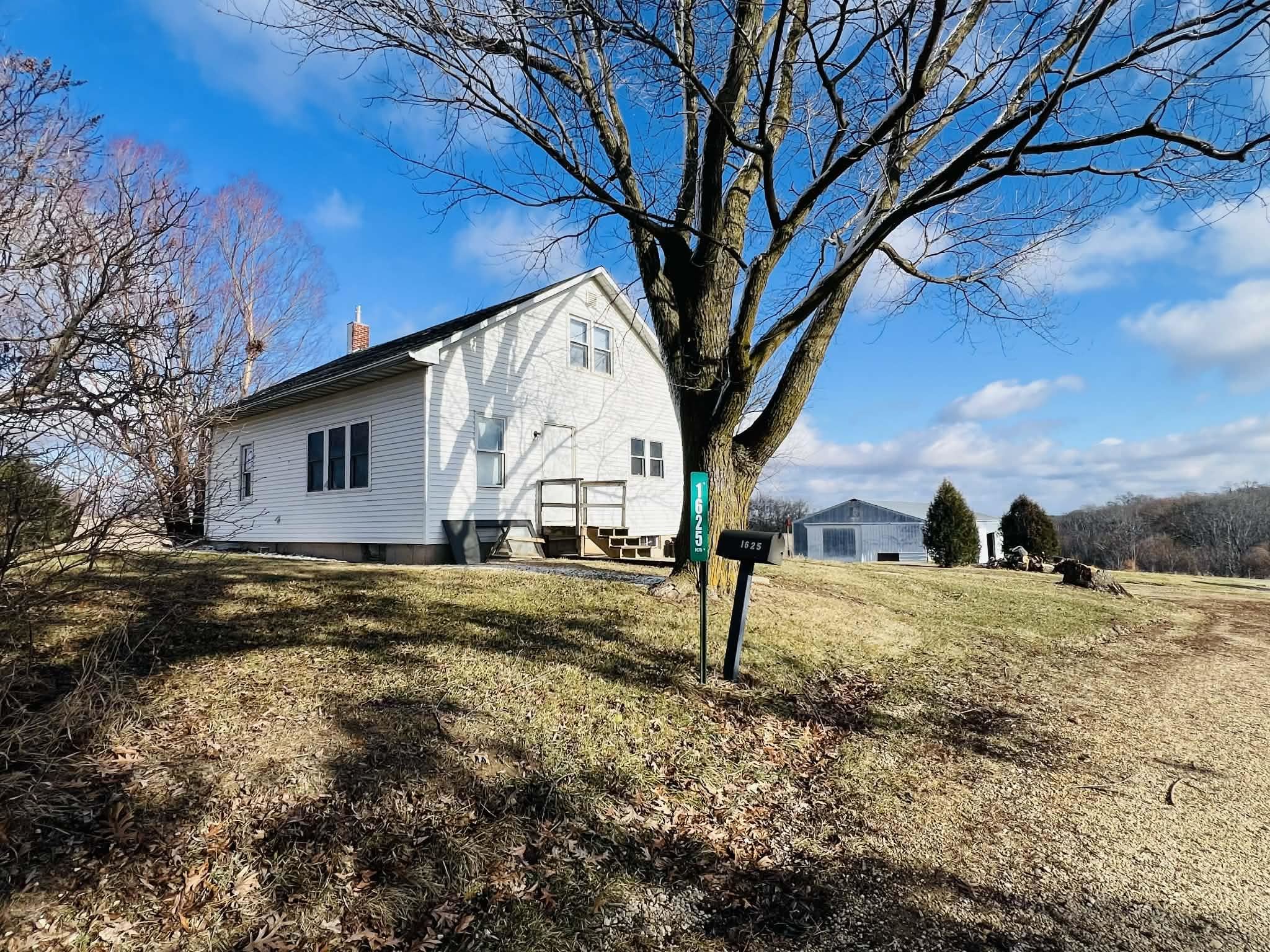 1625 South County Divide Road Pearl City, IL 61062 - Photo 3 of 30 a view of a house with a yard