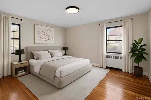 a bedroom with a large bed and a window