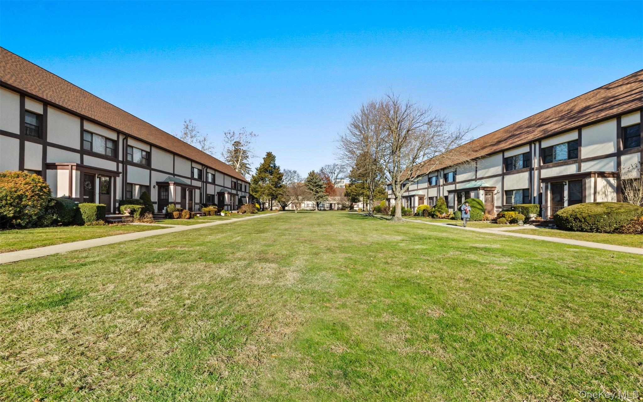 113 15th Street, Unit 1C Garden City, NY 11530 - Photo 2 of 14 a front view of house with yard