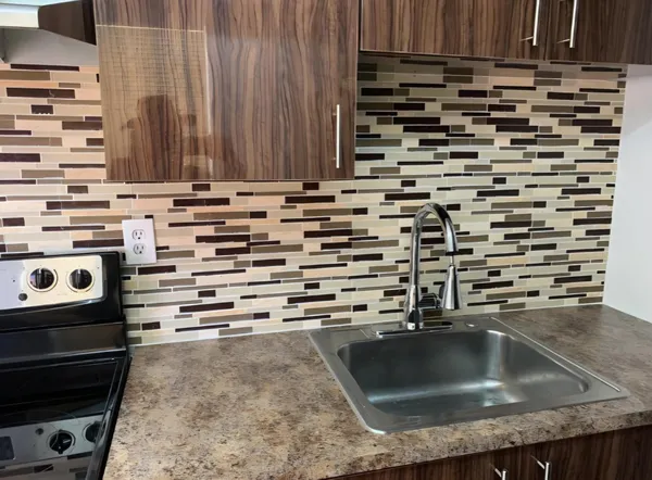 a view of a kitchen counter top space and stove