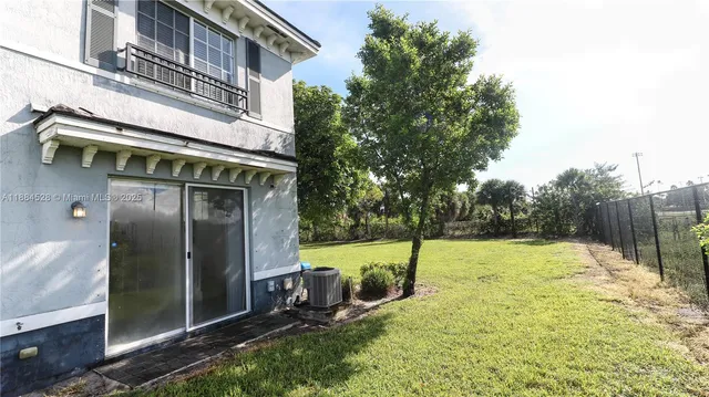 a view of a backyard with a garden and plants