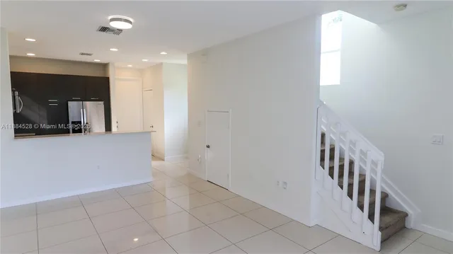 a view of a hallway with seating area