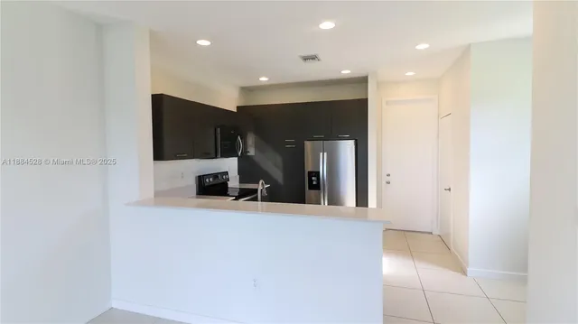 a view of a living room with a large window