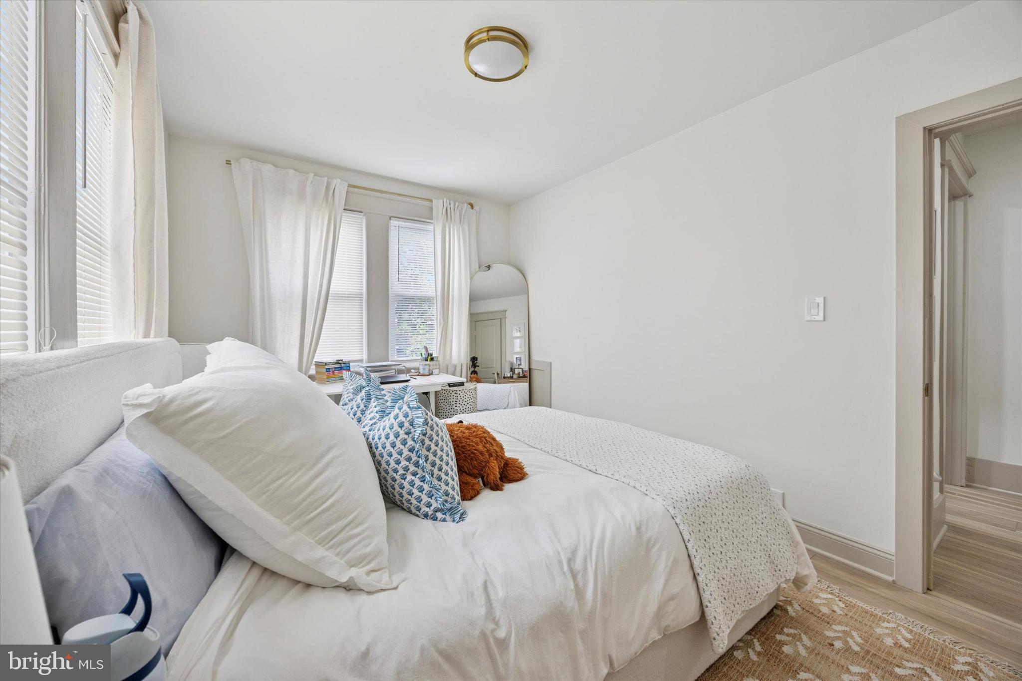 415 North Haddon Avenue, Unit B Haddonfield, NJ 08033 - Photo 12 of 17 a bedroom with a bed and window