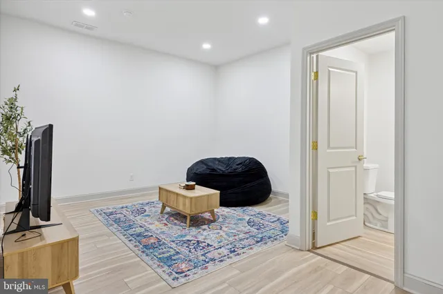 a living room with furniture and a rug