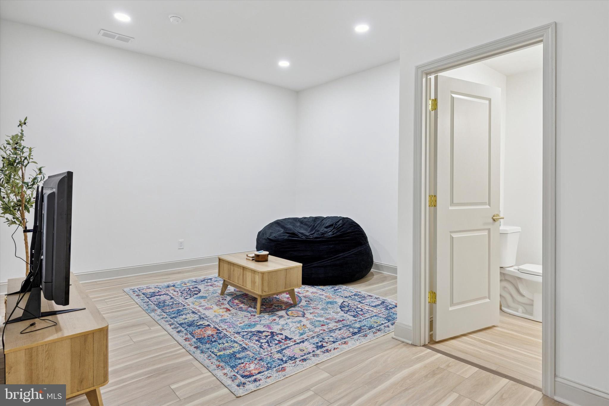 415 North Haddon Avenue, Unit B Haddonfield, NJ 08033 - Photo 5 of 17 a living room with furniture and a rug