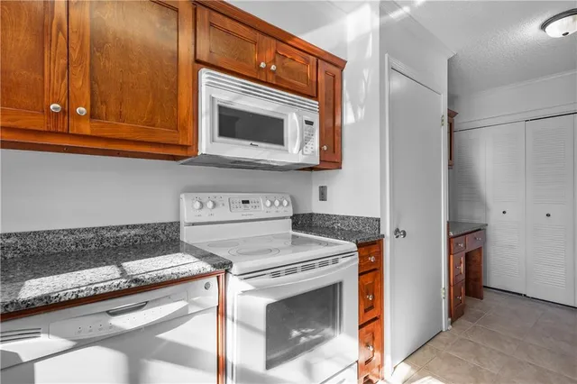 a kitchen with a stove and a microwave