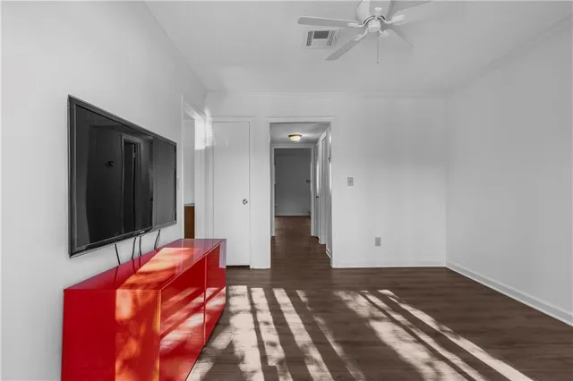 a bedroom with a bed and a mirror