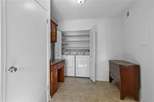 a view of an empty room and fire place