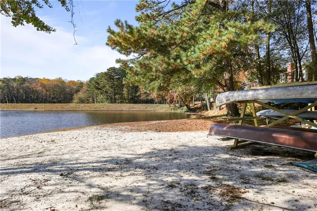 a view of a lake with trees by side of it