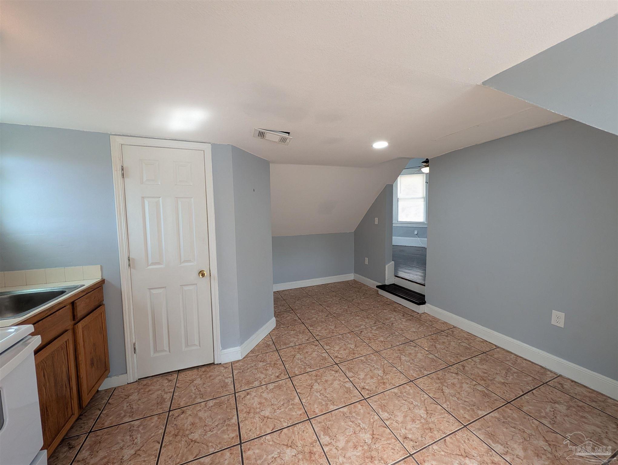911 North Spring Street, Unit 4 Pensacola, FL 32501 - Photo 11 of 16 a view of a kitchen