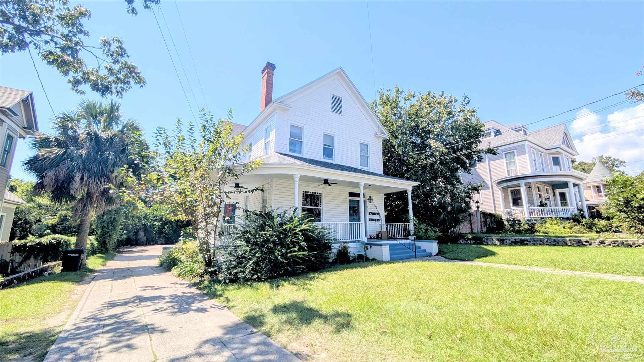 911 North Spring Street, Unit 4 Pensacola, FL 32501 - Photo 2 of 16 a view of house with yard outdoor seating and entertaining space