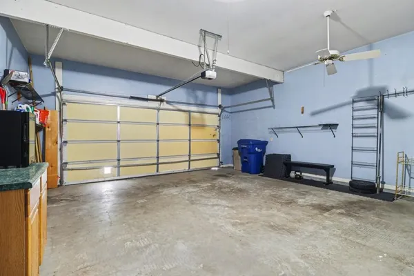 a view of a livingroom with closet and a ceiling fan