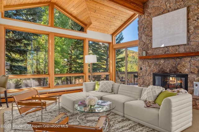 a dining room with furniture and a window