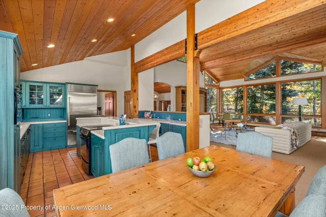 a bathroom with a sink a mirror and next to a window