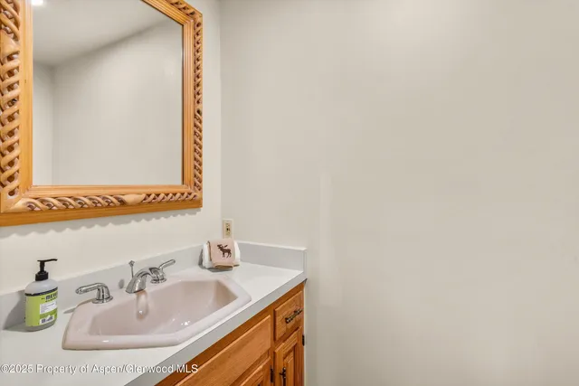 a bedroom with bed and a large window