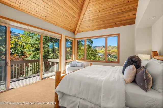 a view of a balcony with wooden fence and floor