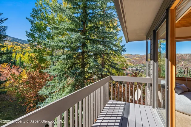 a spacious bathroom with a granite countertop sink and a mirror