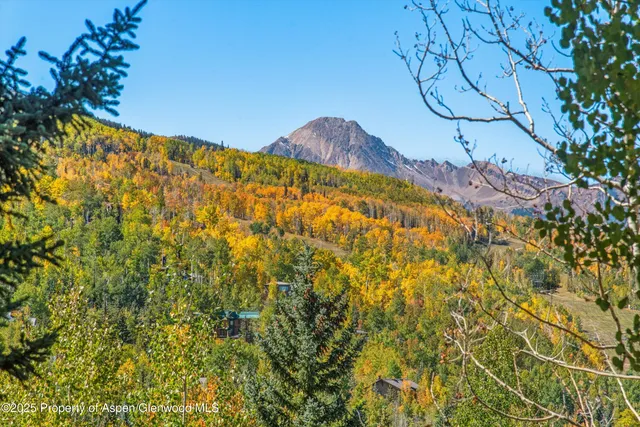 a bathroom with a granite countertop sink a toilet and a bathtub
