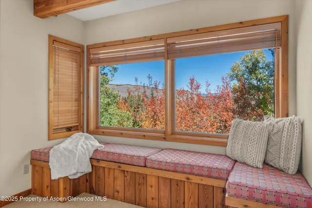 a view of a roof deck with wooden floor and fence