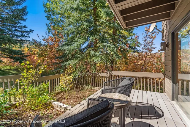 a spacious bedroom with a bed and a window