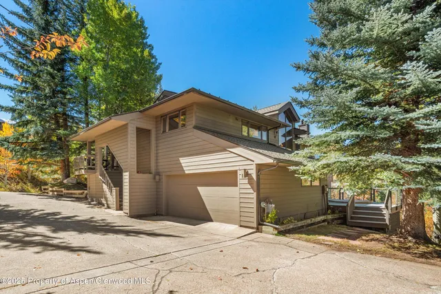 a front view of a house with a garage