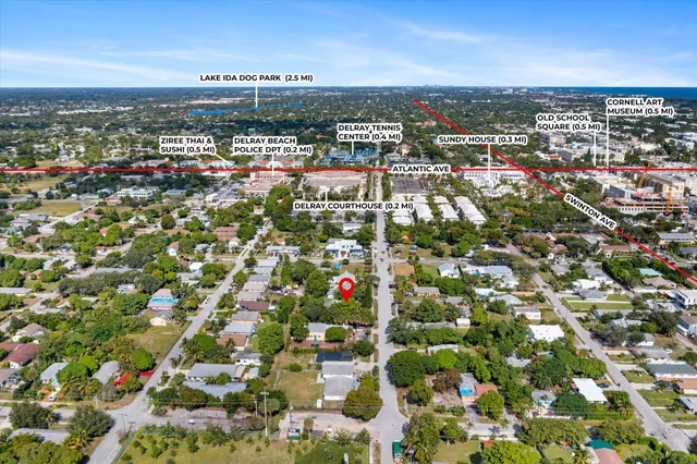 an aerial view of residential houses with city view