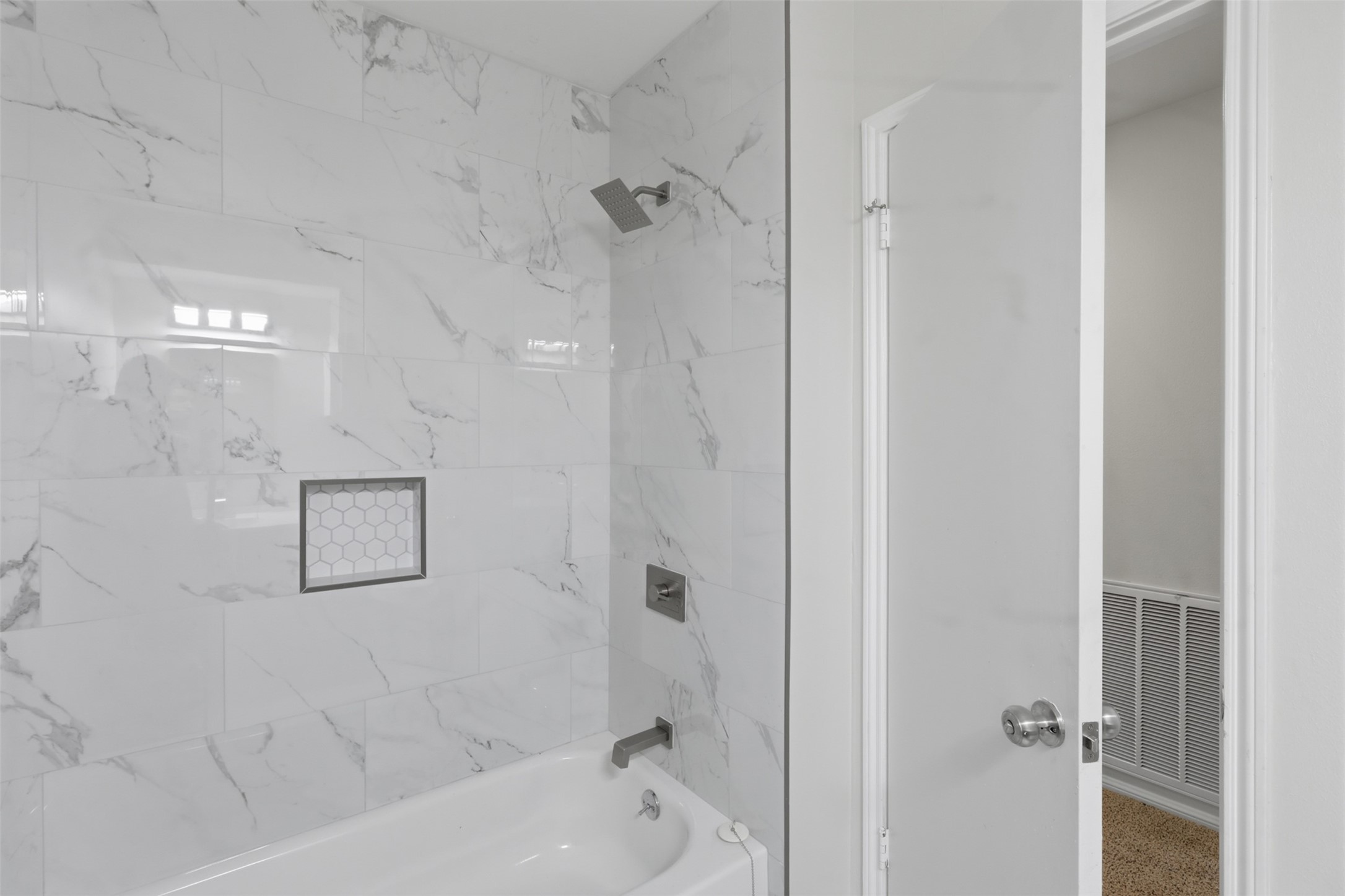 17519 Butte Creek Road Houston, TX 77090 - Photo 26 of 37 Secondary Bathroom with a tub/shower combo featuring DESIGNER tile!