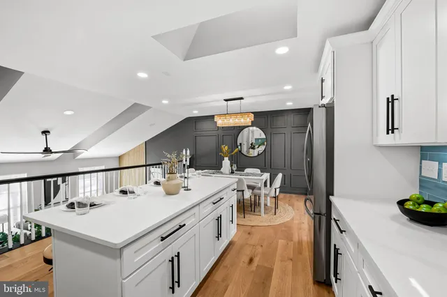 a kitchen with a stove a sink and a refrigerator