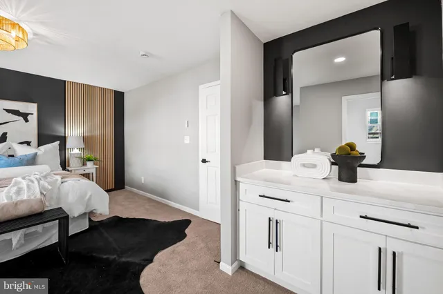 a bathroom with a sink vanity granite and a mirror