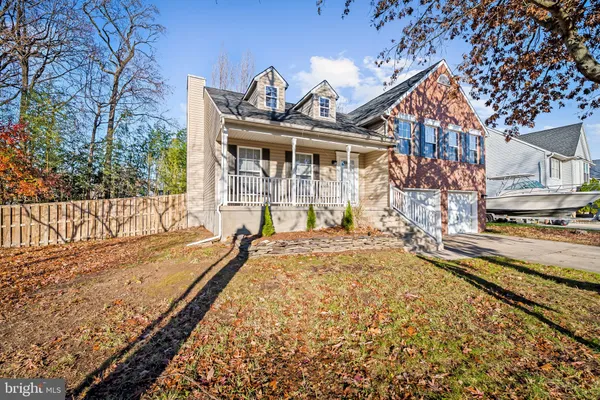 a view of a house with a bed and a yard