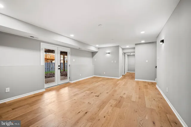 a view of a room with wooden floor