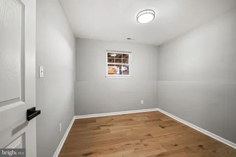 a bathroom with a sink a toilet a shower and a mirror