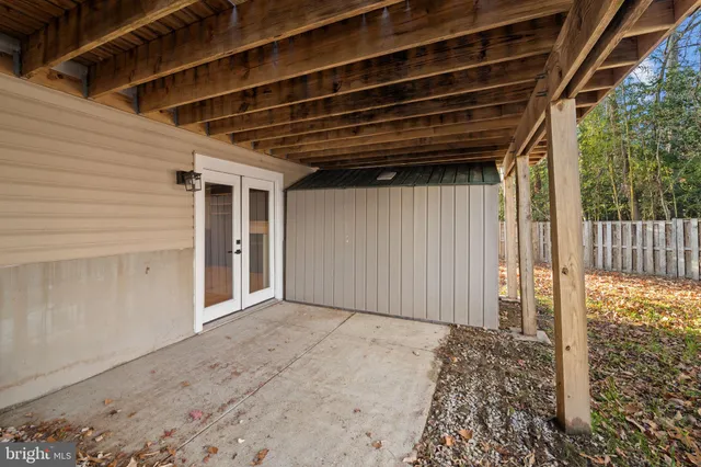 a view of a backyard with wooden fence