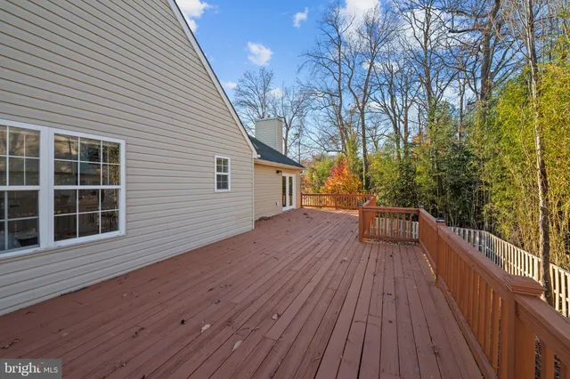 a view of a lake with chairs
