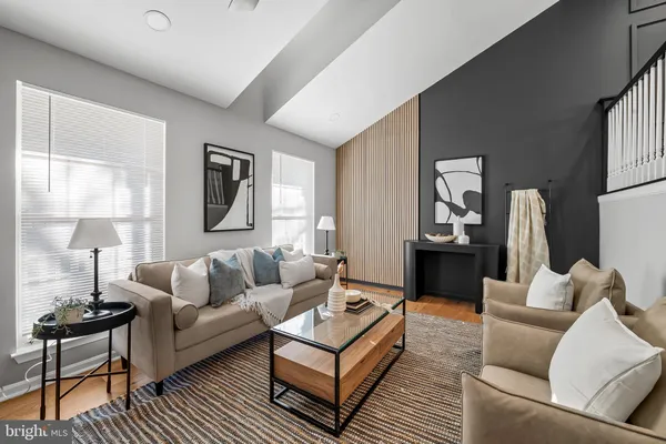 a living room with furniture and a lamp