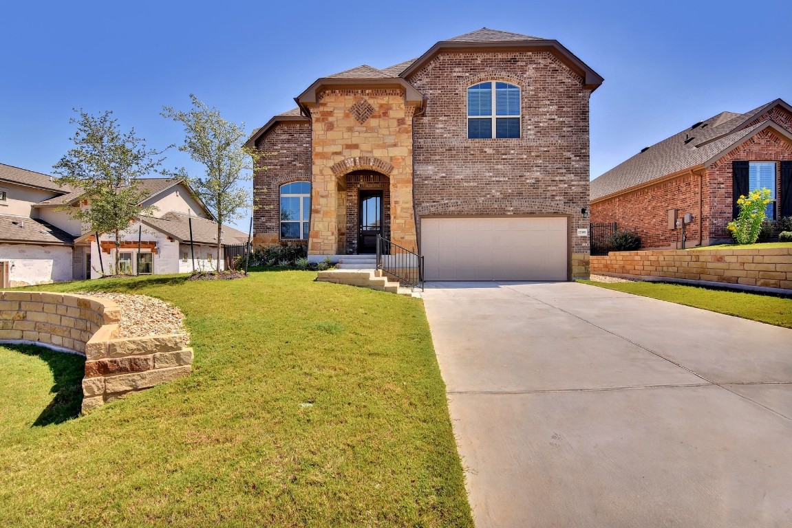 a front view of a house with a yard