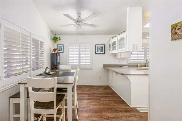 a kitchen with a table chairs stove and microwave