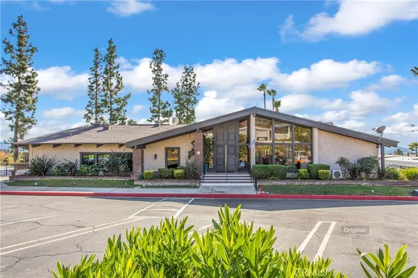 a view of livingroom with fireplace wooden floor and dining room