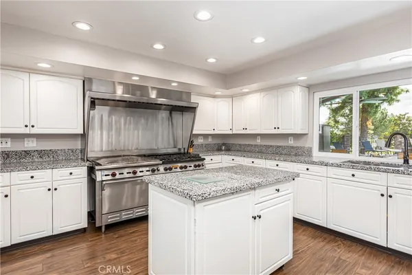 a room with furniture and pool table