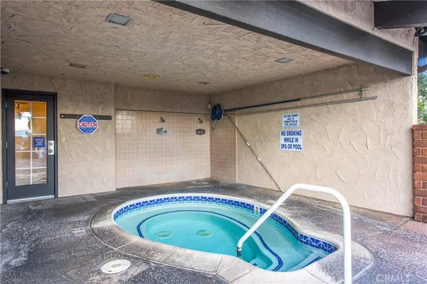 a view of a swimming pool with a lounge chairs