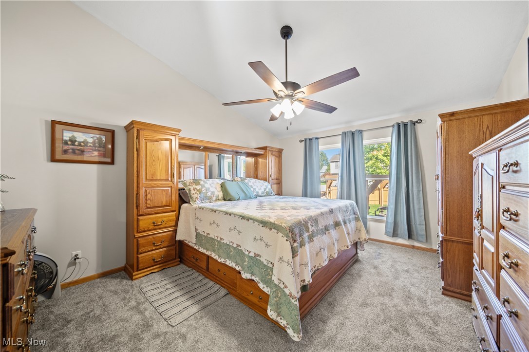 1951 Haines Road Madison, OH 44057 - Photo 17 of 44 Bedroom with vaulted ceiling, ceiling fan, and light colored carpet