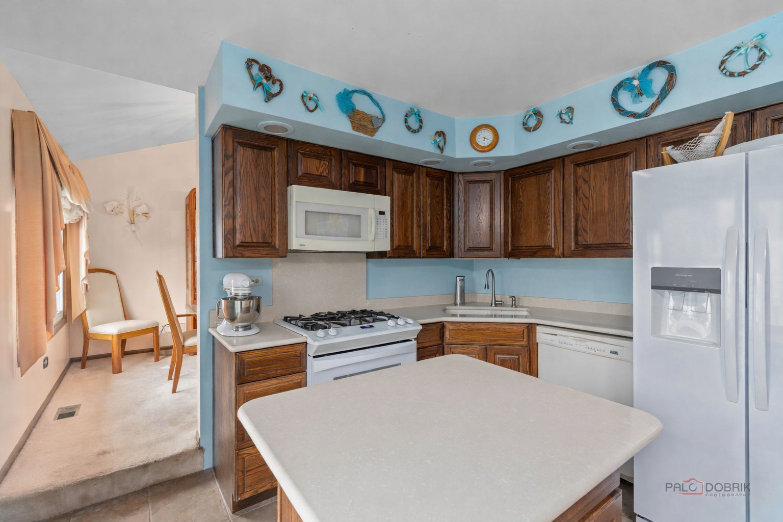 1124 Anvil Court Addison, IL 60101 - Photo 9 of 43 a kitchen with stainless steel appliances granite countertop a refrigerator and a stove top oven