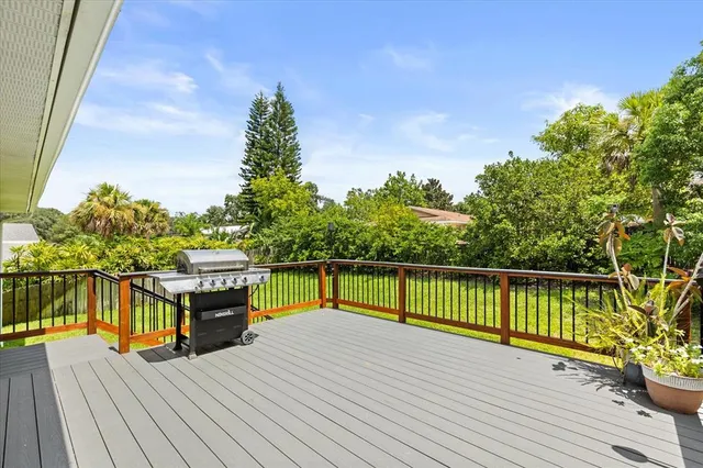 a view of a balcony with wooden floor