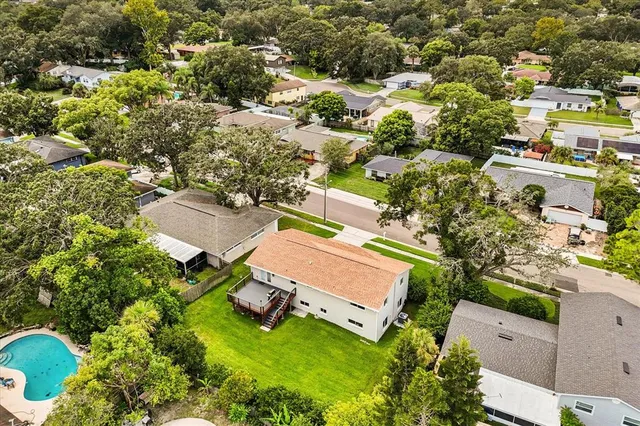 an aerial view of a house with a garden